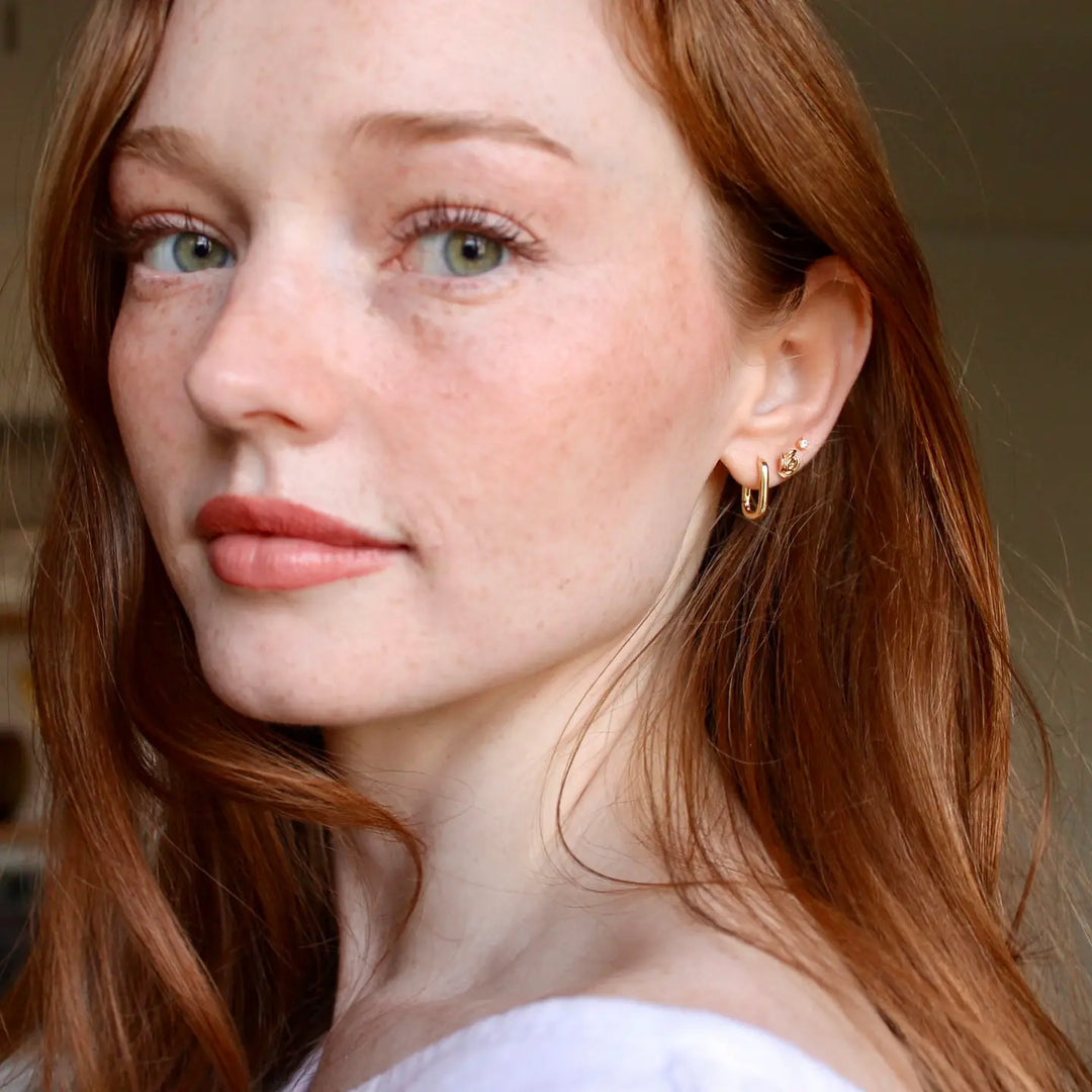 Kris Nations – Oval Hinged Huggie Hoop Earrings in 18K Gold Vermeil