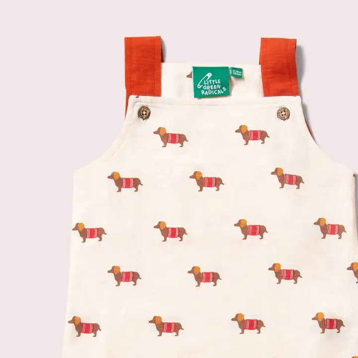 Little Green Radicals –– Sausage Dog Storytime Dungarees in Cream
