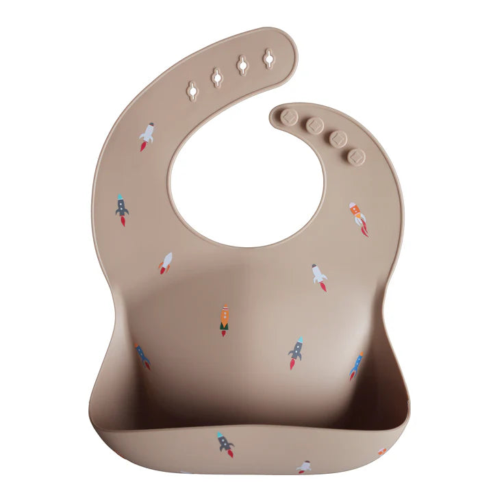 Mushie - Silicone Baby Bib in Rocket Ship