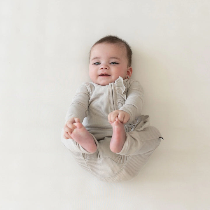 Kyte Baby - Ribbed Ruffle Zipper Romper in Oat