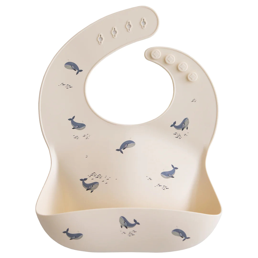 Mushie - Silicone Baby Bib in Whales