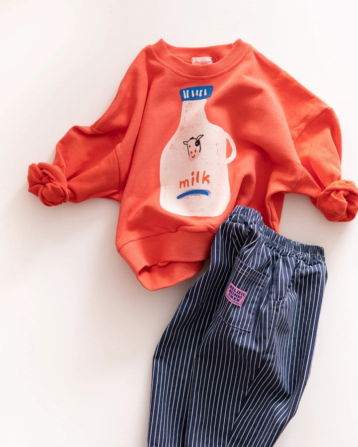 Pigeon Said Please – Milk Jug Sweatshirt in Magazine Stand Red