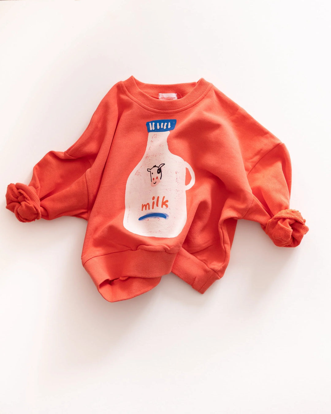 Pigeon Said Please – Milk Jug Sweatshirt in Magazine Stand Red
